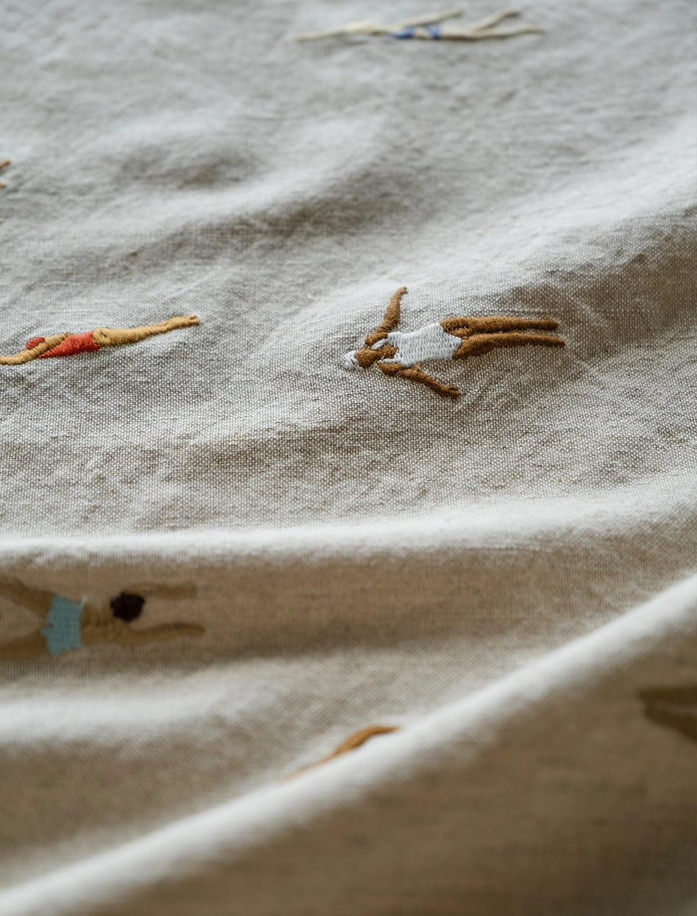 SWIMMERS EMBROIDERED FABRIC