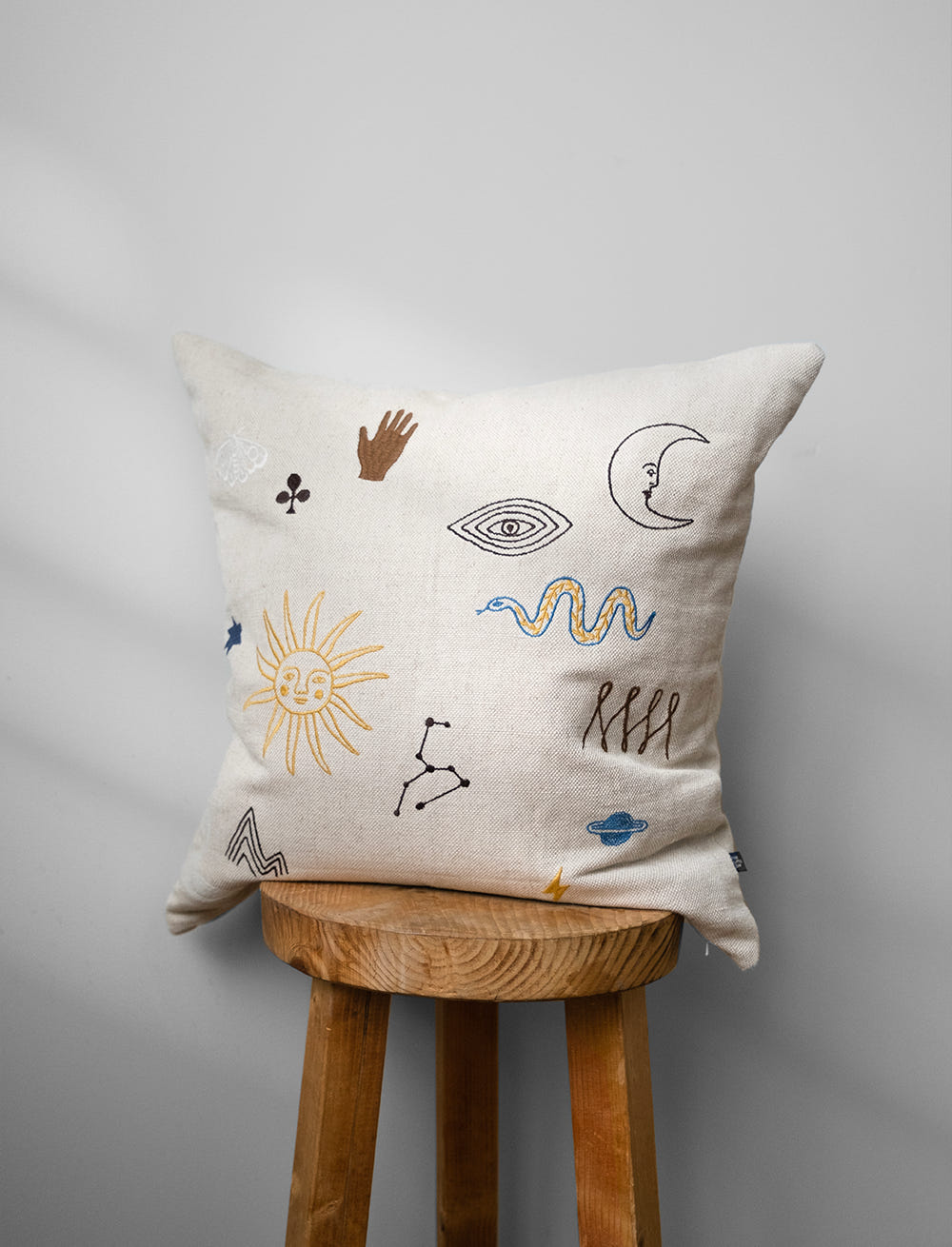 SYMBOL EMBROIDERED CUSHION COVER