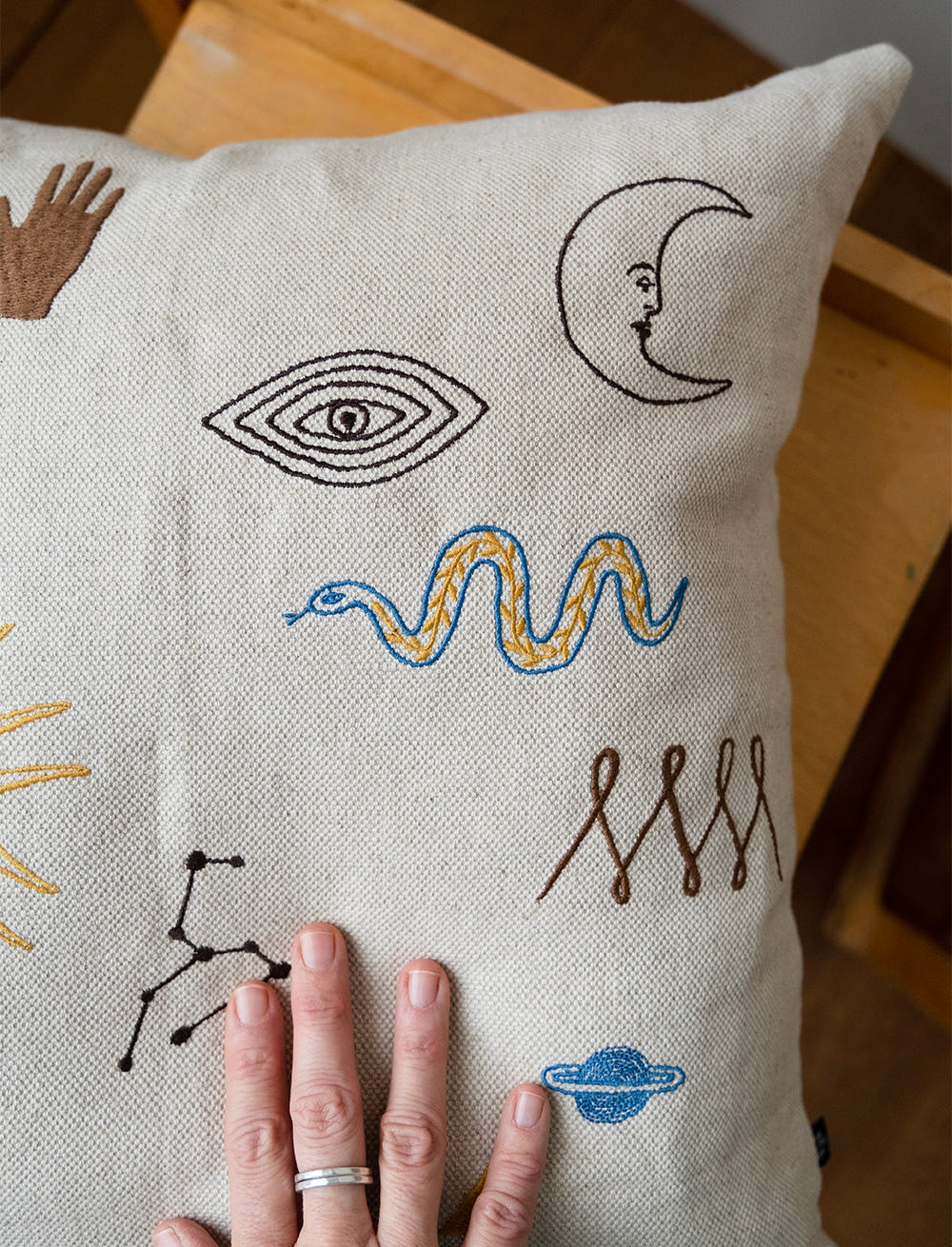 SYMBOL EMBROIDERED CUSHION COVER